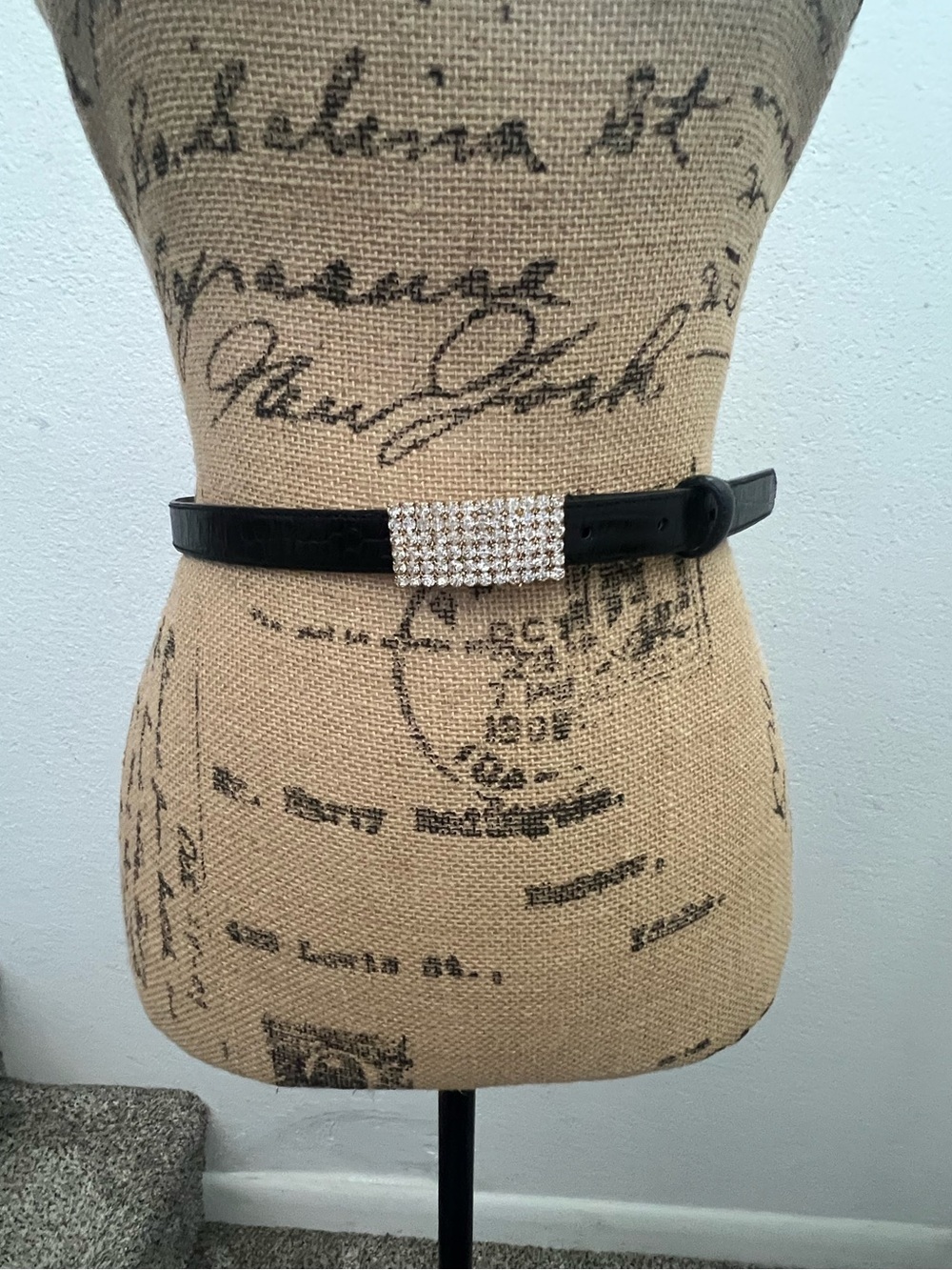 Black leather belt with stone studded buckle